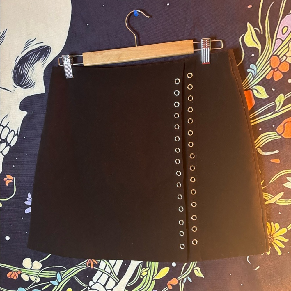Black eyelet mini skirt